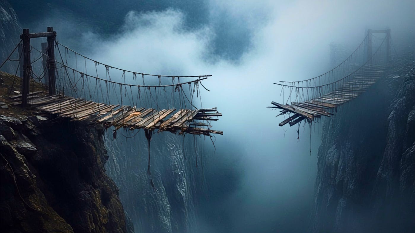A wooden rope bridge over a misty canyon is broken in the middle, its two halves hanging from opposite cliffs.
